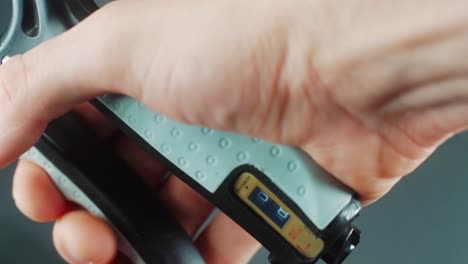 a close up shot of a man hand squeezing a arm clamp trainer, 4k video, fitness sport 2