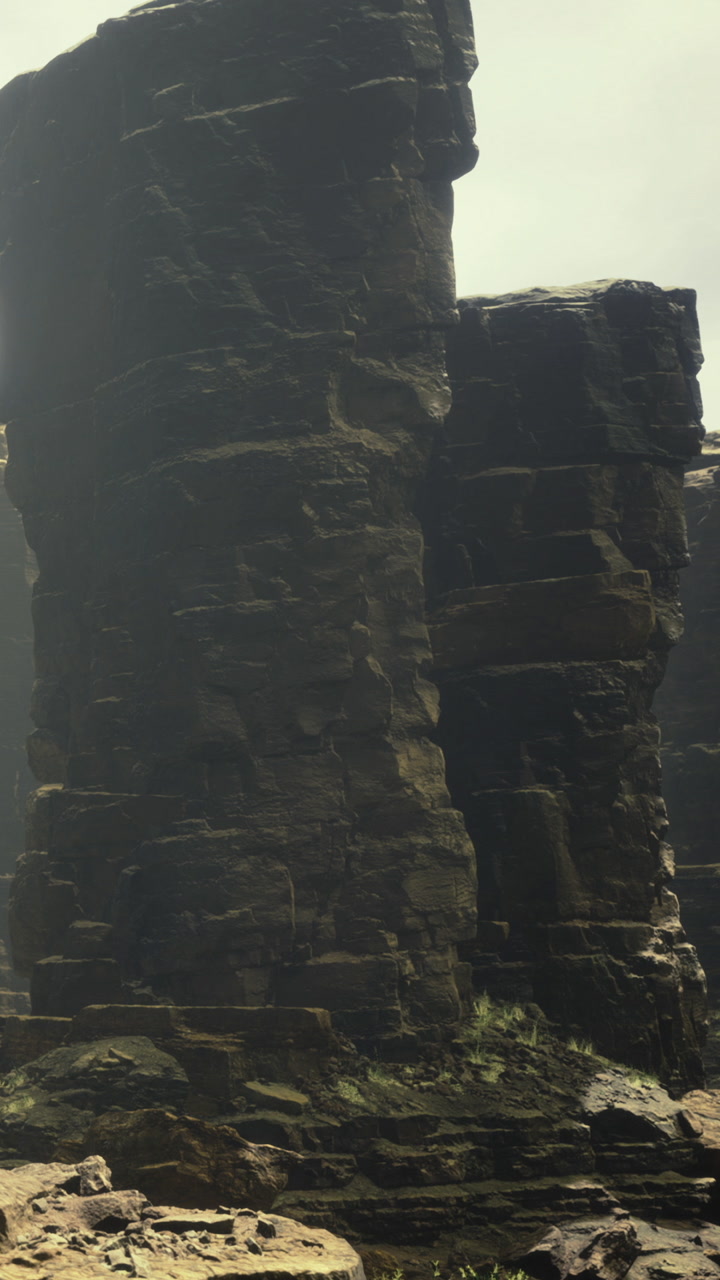 Majestic rocky formations rise under the cloudy sky in a serene landscape