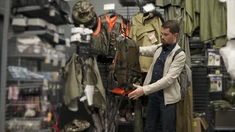 man shopping for hunting/outdoor gear