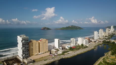 skyscrapers between canal and sea in tourist, financial, commercial and residential zone