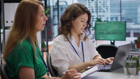 job candidate sits across from interviewers team in high end office