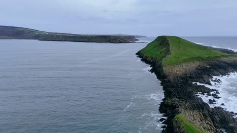 flying along the spine of the dragon towards worms head, rhossili bay, wales