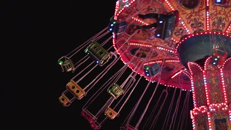 colorful slow motion carousel at night in a park