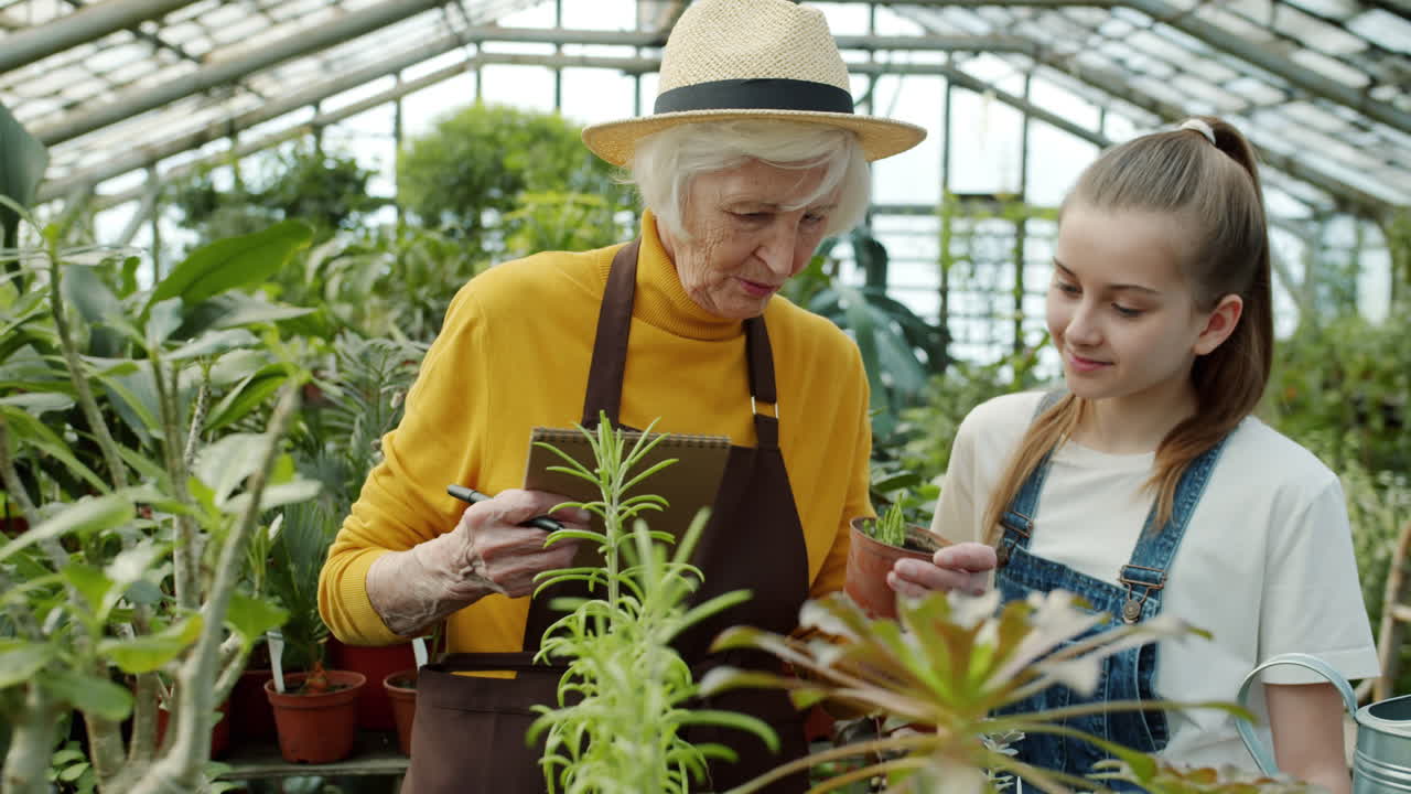 Grandmother and Granddaughter in a Greenhouse