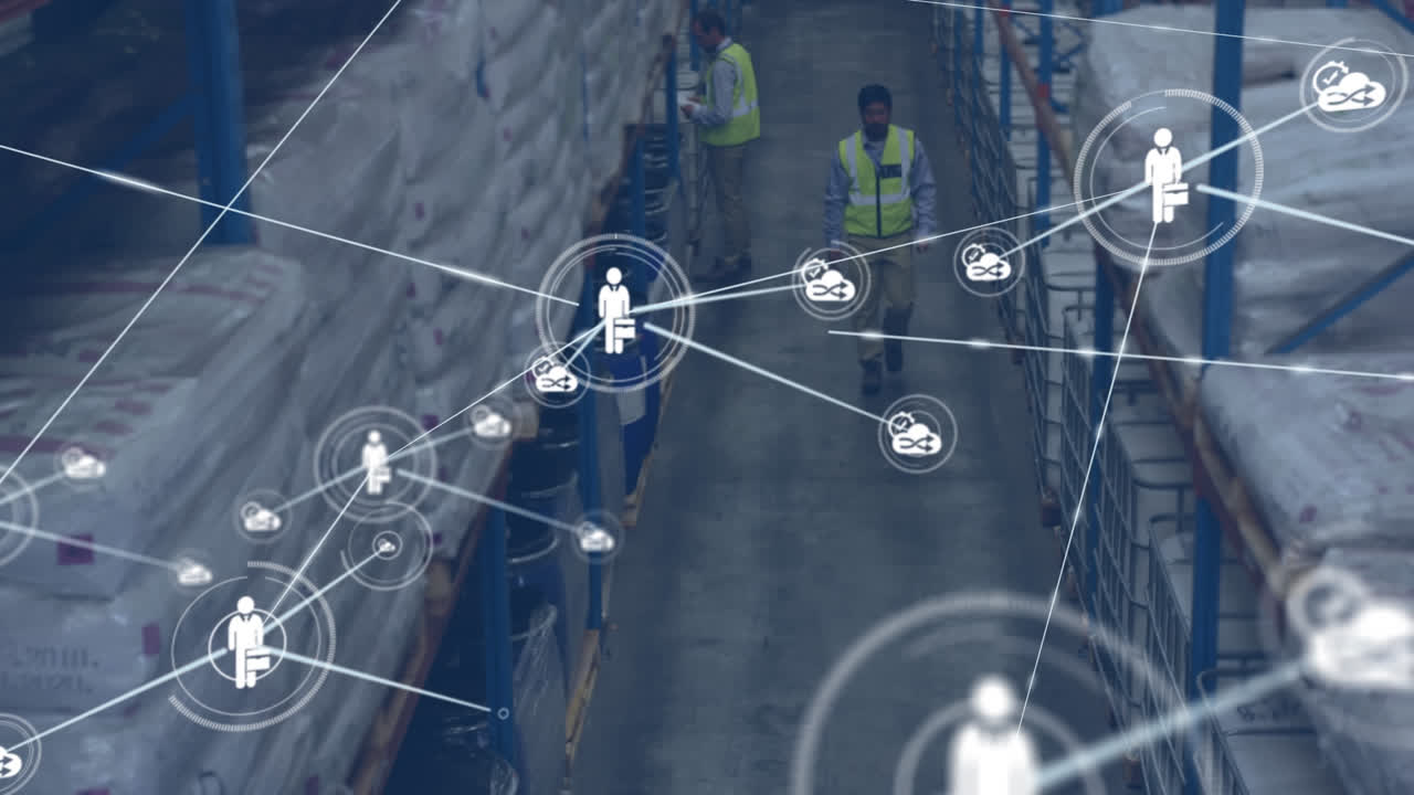 Animation of network of digital icons against african american male worker walking at warehouse