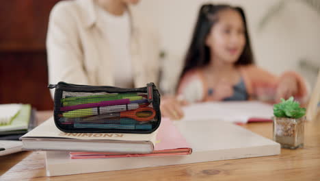 Homework,-stationery-and-child-with-parents