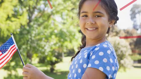 Animación-De-Una-Niña-Sonriente-Sosteniendo-La-Bandera-Americana