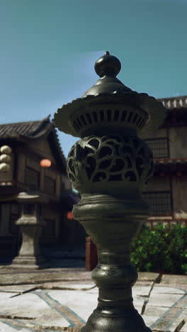 a chinese lantern on a street in a town