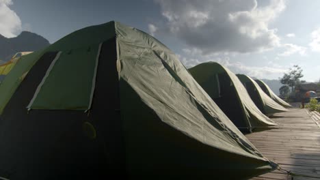 camping tents on a wooden deck in the mountains
