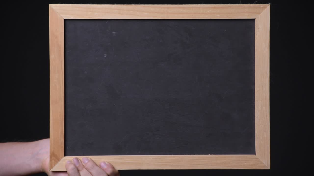 Hand Holding Empty Blackboard