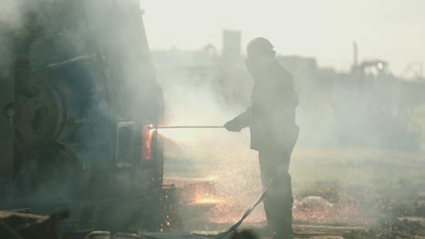 metal torcher cutting metal slow motion with sparks and fire