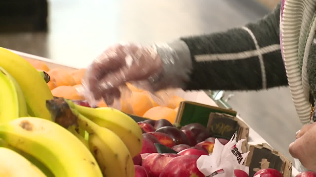 Person shopping for fruits in a market