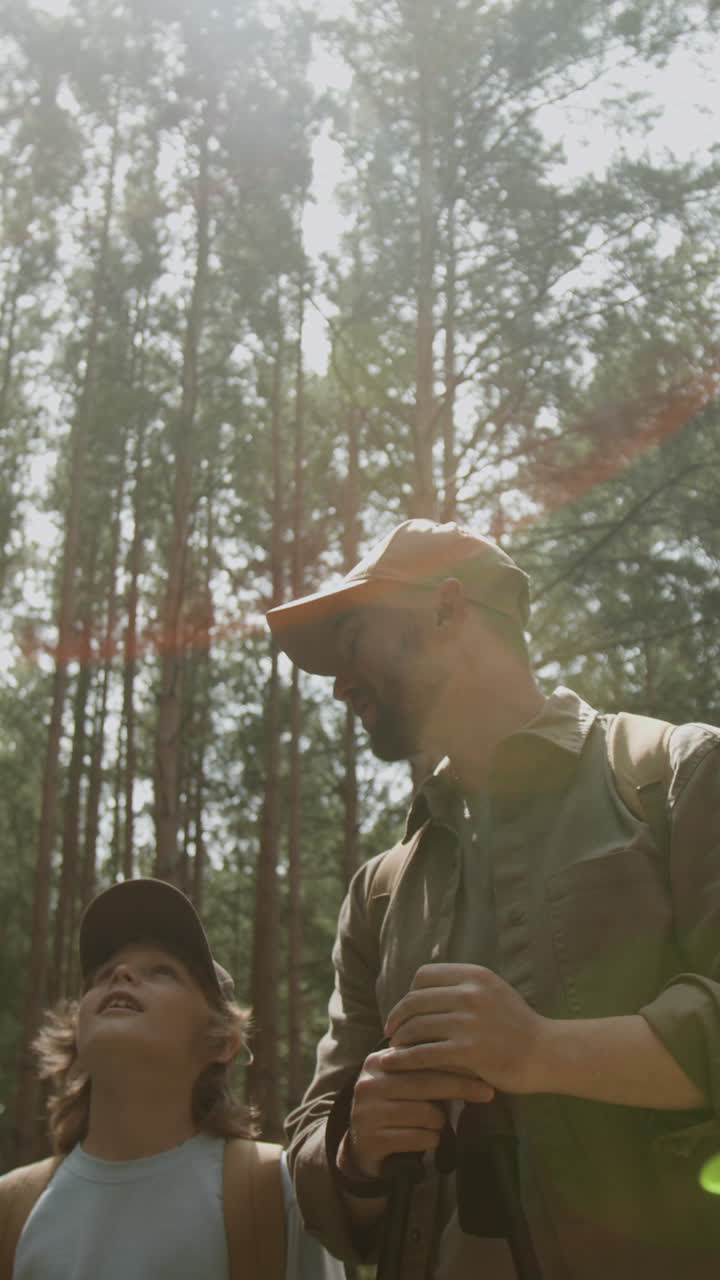 Father and son hiking in forest