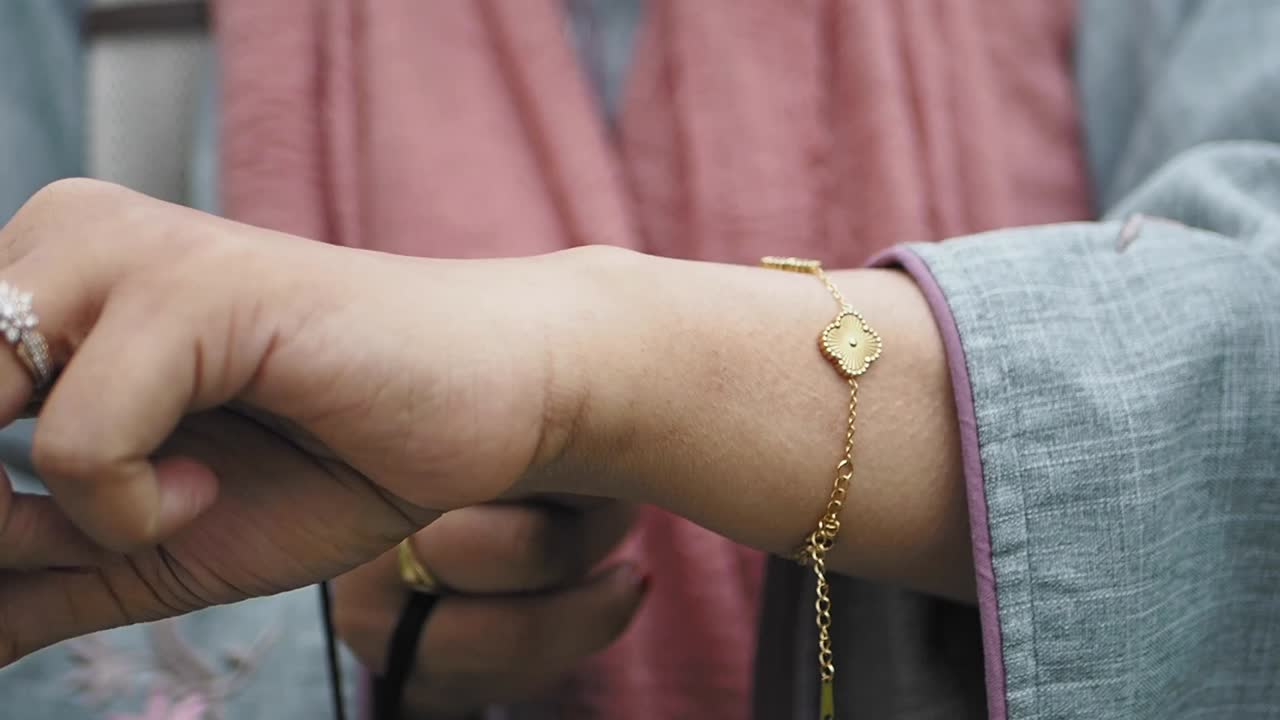 Woman wearing a gold bracelet