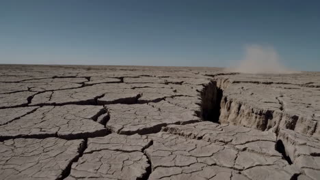 cracked earth fissure in arid landscape