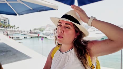 athens marina respite: tourist feels the summer breeze