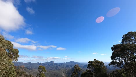 clouds moving swiftly across a mountainous landscape