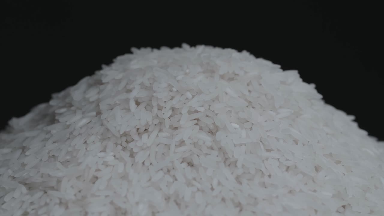 Asian Main Food, Raw White Pile Of Rice Grain Rotating In A Slow Motion