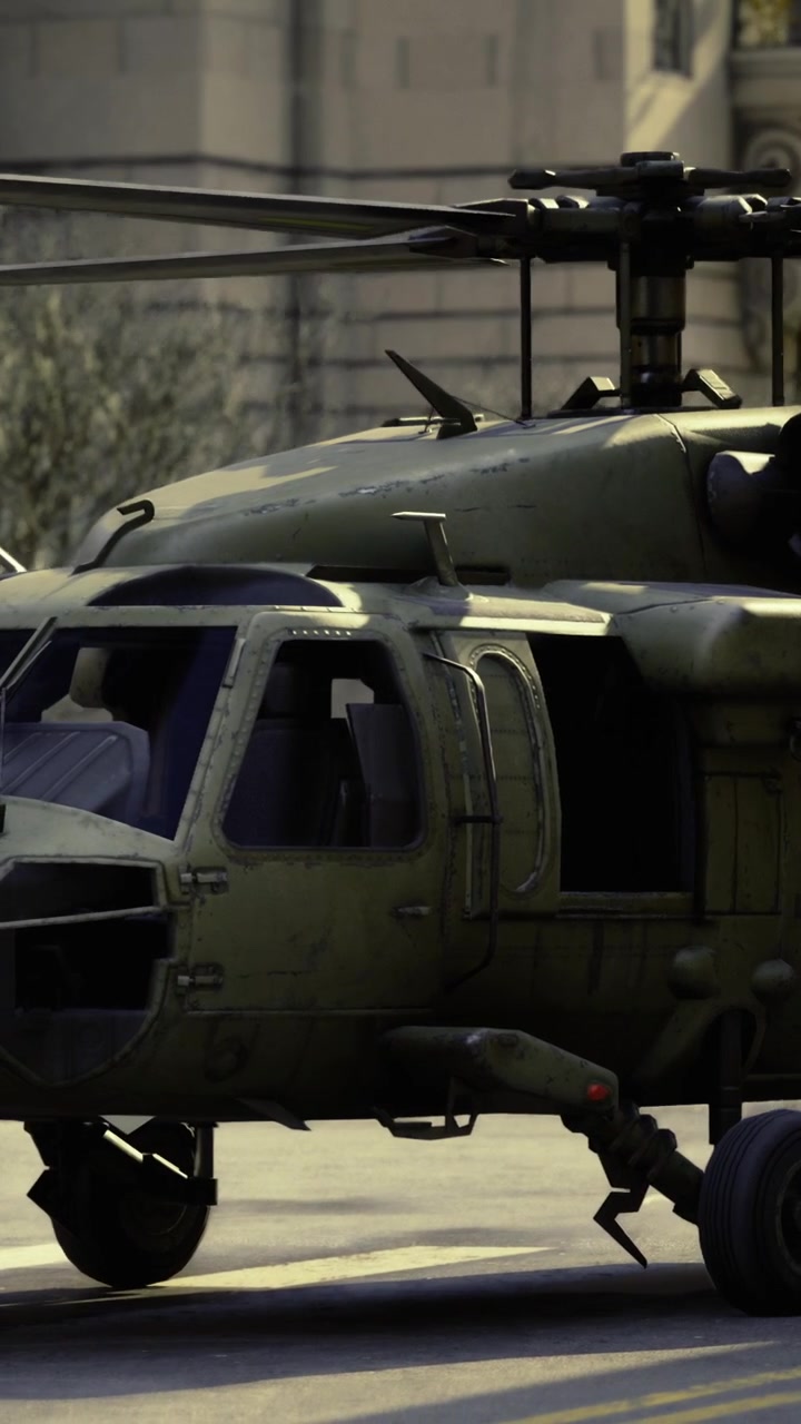 Military helicopter on a city street during daytime operation