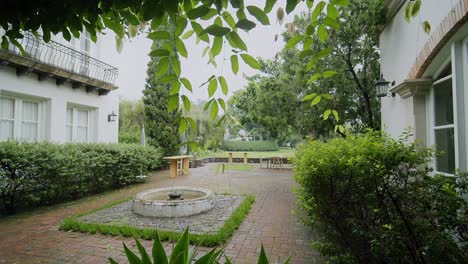 a view of an elegant courtyard at a fancy resort in antigua, guatemala. the scene showcases sophisticated design and lush surroundings, capturing the resort's upscale ambiance