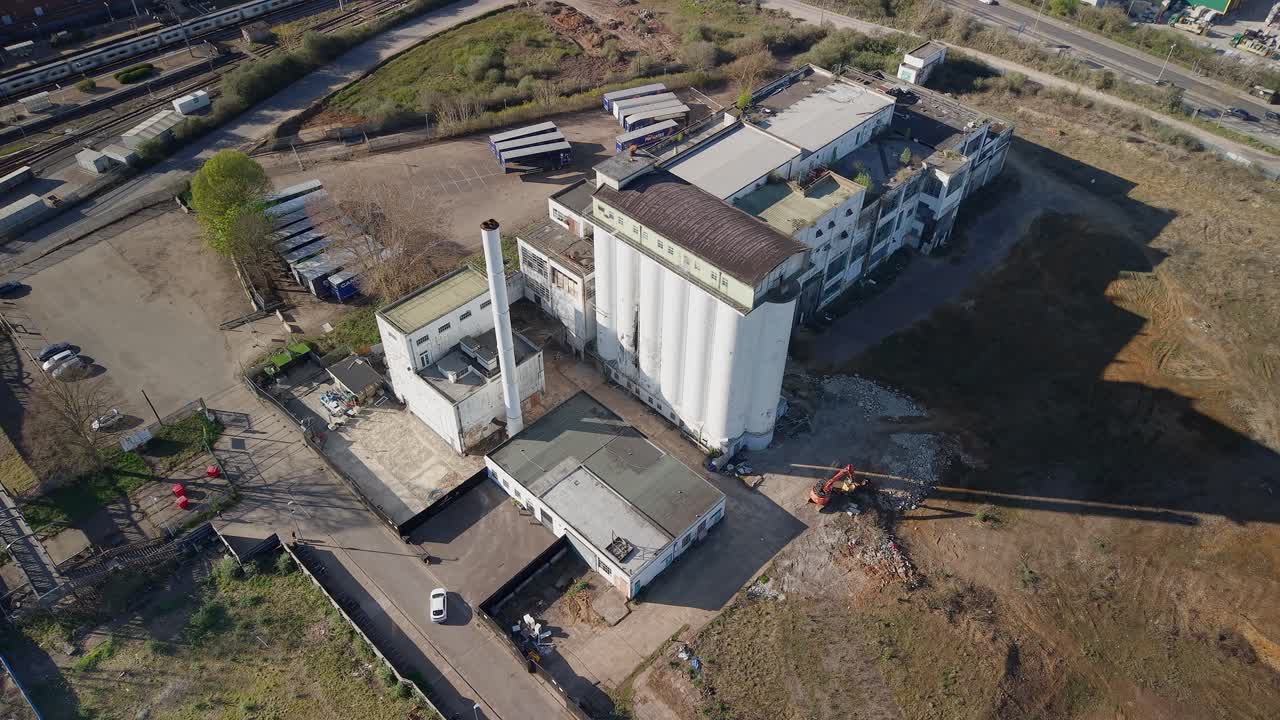 Wheat quarter aerial view over disused vacant development land site offices for regeneration project