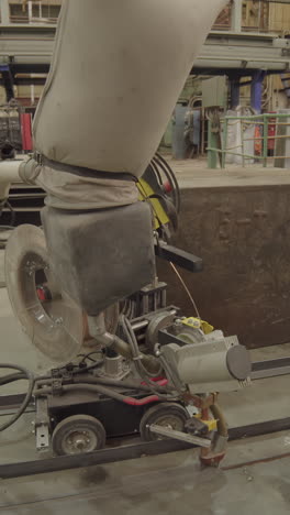 robotic welding machine in an industrial setting