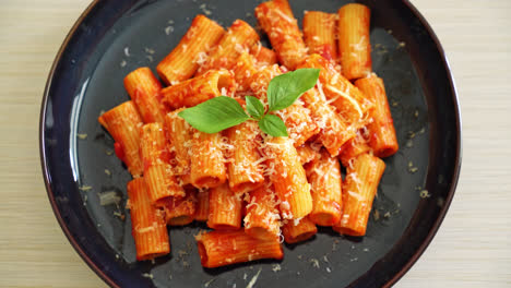 rigatoni pasta with tomato sauce and cheese - traditional italian pasta