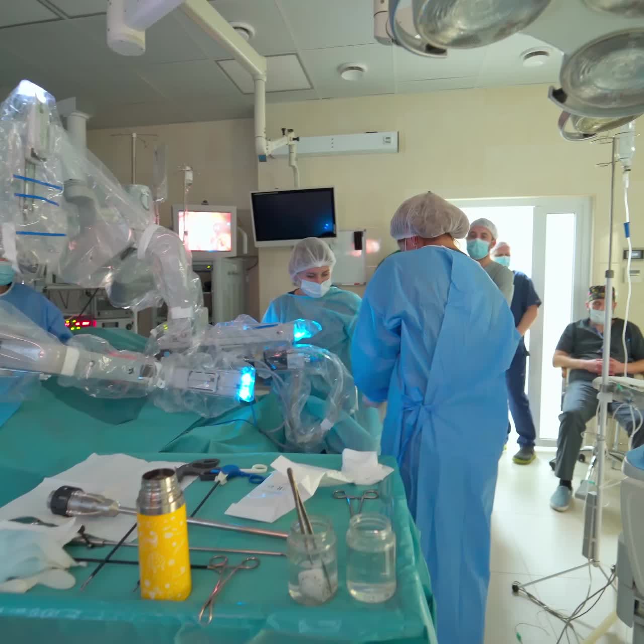 Doctors perform surgery in operating room. Manual control by minimally invasive robotic surgery