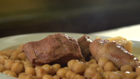 close up of cocido madrileño, traditional chickpea-based stew from madrid, spain