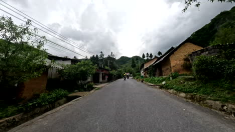 ha giang loop, northern vietnam, asia - traversing the picturesque road on a scooter - pov