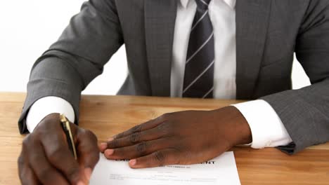 businessman filling a insurance form