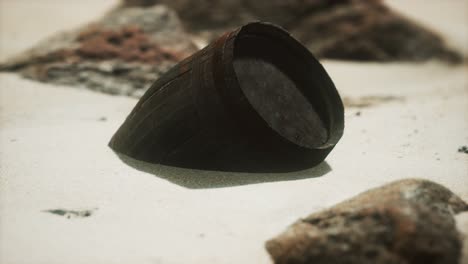 old wooden barrel on the beach