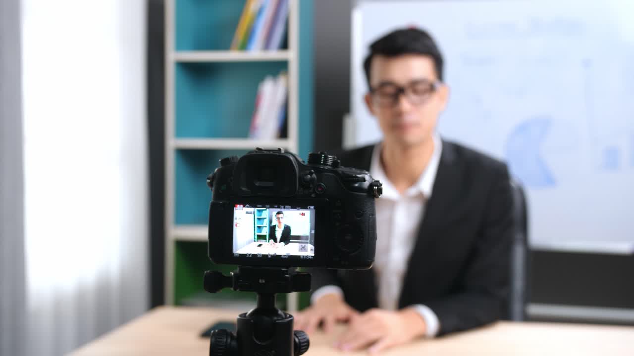 Asian Business Man Recording Video At Home