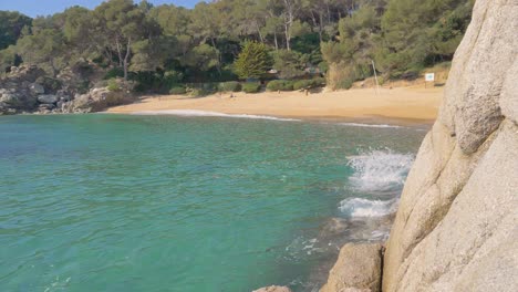 ocean waves rolling into a beautiful beach in slow motion, natural landscape, spain