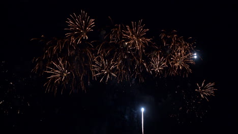 flashing fireworks and sparks at night sky