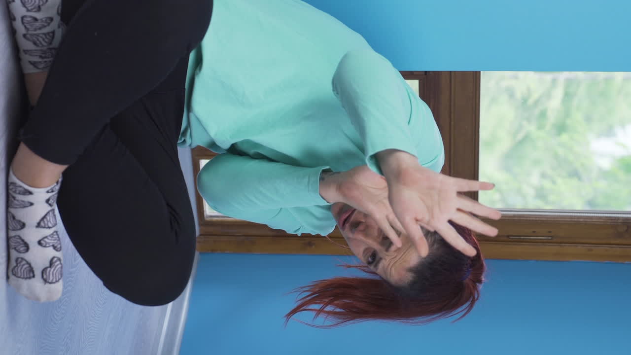 Vertical video of Paranoid guy pretending someone's coming.