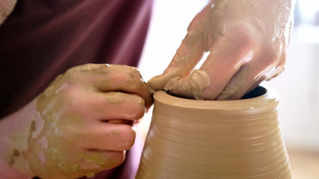 Person Making Pottery on a Pottery Wheel
