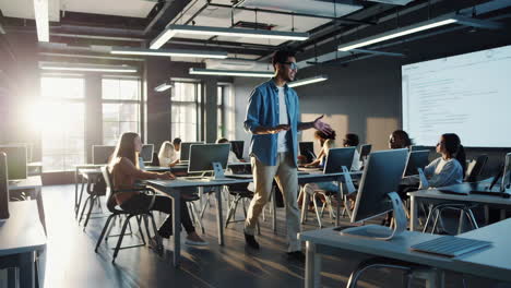 instructor guides students in a modern computer lab