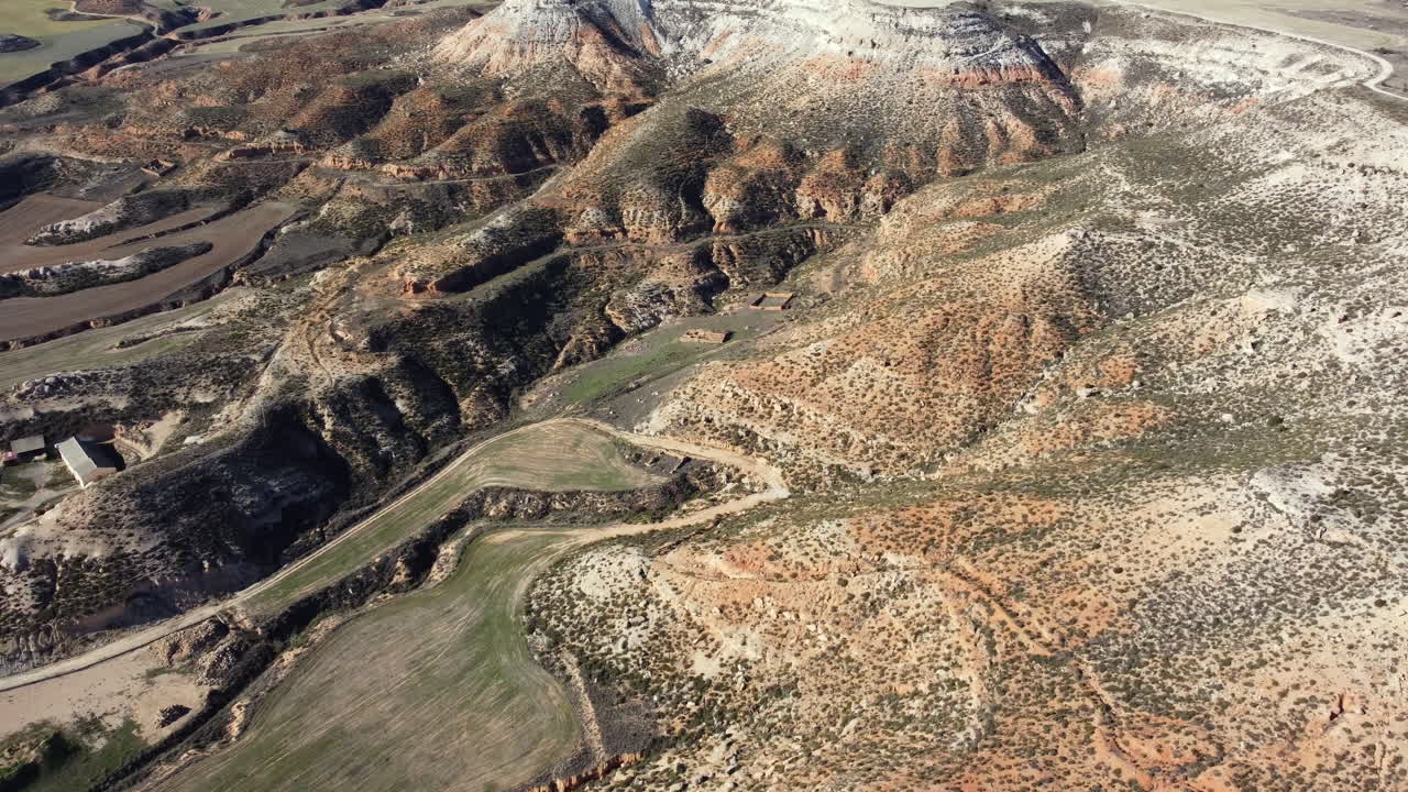 Aerial View of a Spanish Desert Landscape with Hills, Valleys and Farmland