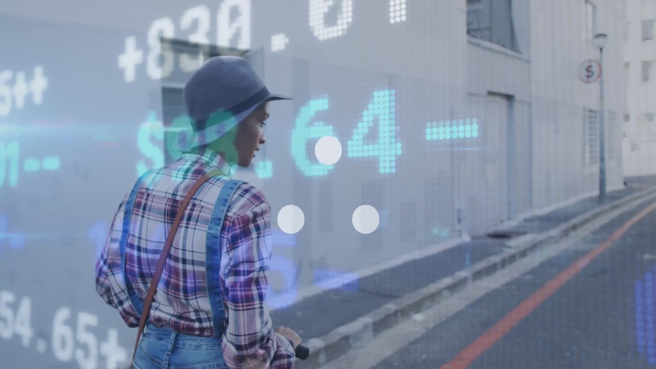 A happy mixed race woman is out and about in the city on a sunny day, wearing a hat and riding on an