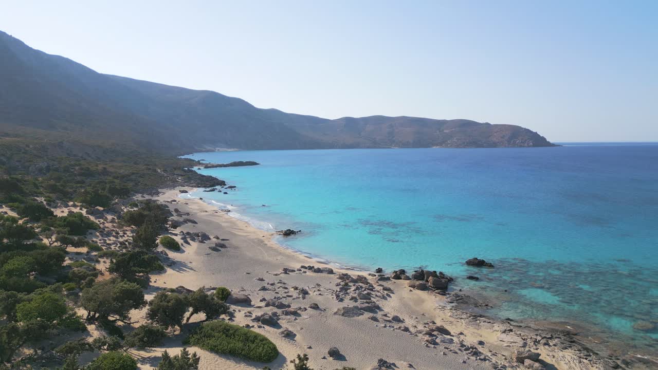 Steady morning shot capturing the serene beauty of Kedrodasos Beach in Crete, with crystal-clear waters, soft sand, and a calm Mediterranean atmosphere