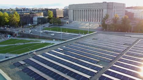 flyover: rooftop solar panels on building opposite finland parliament