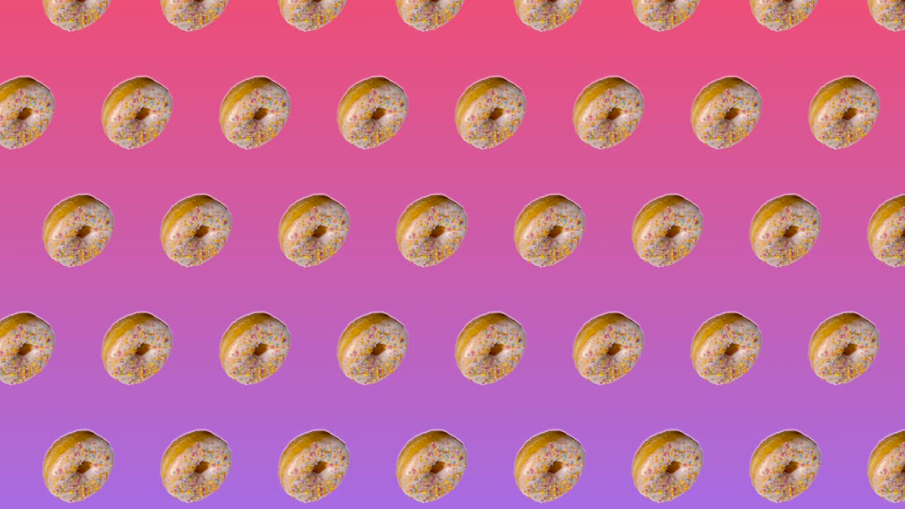 animación abstractamente colorida - rosquillas de vista lateral con salpicaduras de azúcar coloridas se mueven hacia arriba en círculo diagonalmente en fondo de gradiente rosa - bucle sin costuras.