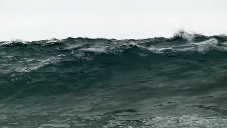 Close-Up-of-Ocean-Waves-Curling-and-Crashing-on-the-Beach