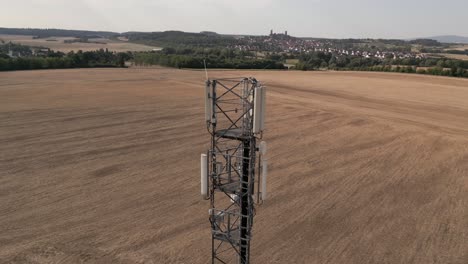 Drone-shot-orbiting-telephone-cell-signal-tower-in-Hessen,-Germany