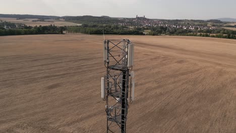 drone shot orbiting telephone cell signal tower in hessen, germany