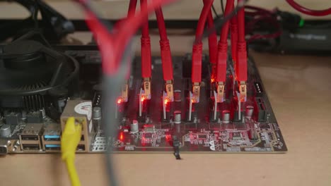 close up of cryptocurrency mining rig's power cords be connected on the table