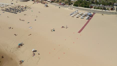 aerial drone shot of the carvelos beach with accessibility for people with reduced mobility, near lisbon, portugal
