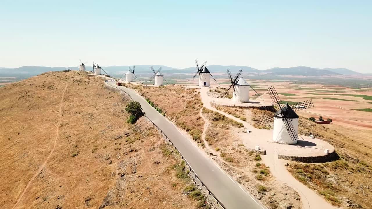 Aerial view capturing the iconic windmills of Consuegra in Castilla–La Mancha, Spain, highlighting the traditional landscape and rich cultural heritage, known for el quixote epical tale