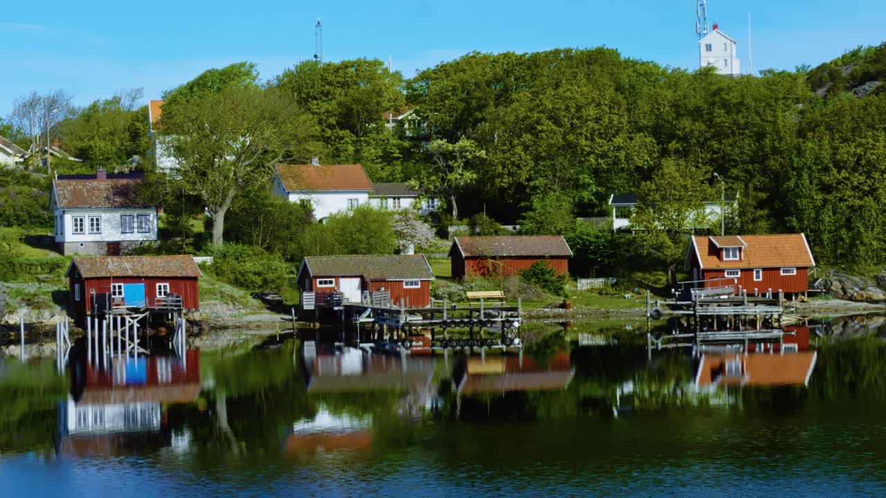 Peaceful scene of Swedish archipelago with colorful houses along calm water